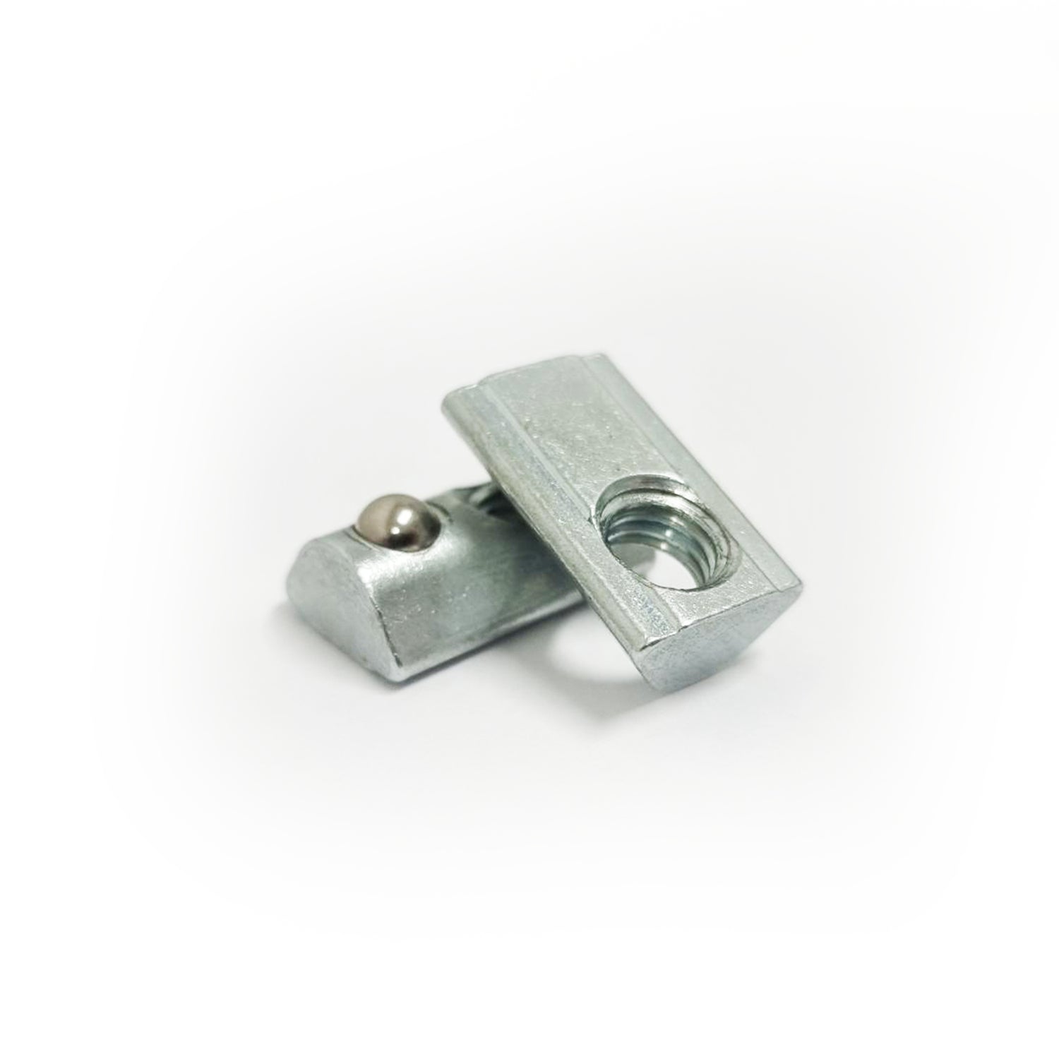 A white modern sneaker with a unique sole design on a green background.