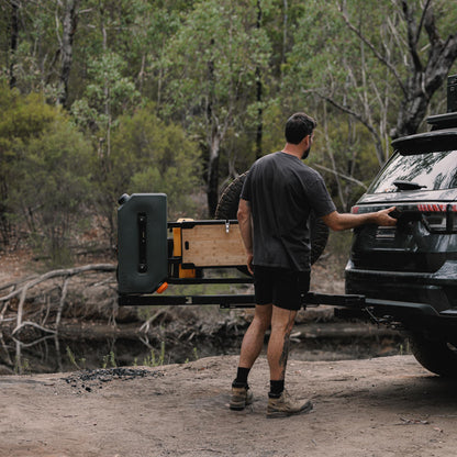 Compact alloy camp table folded out from gear carrier