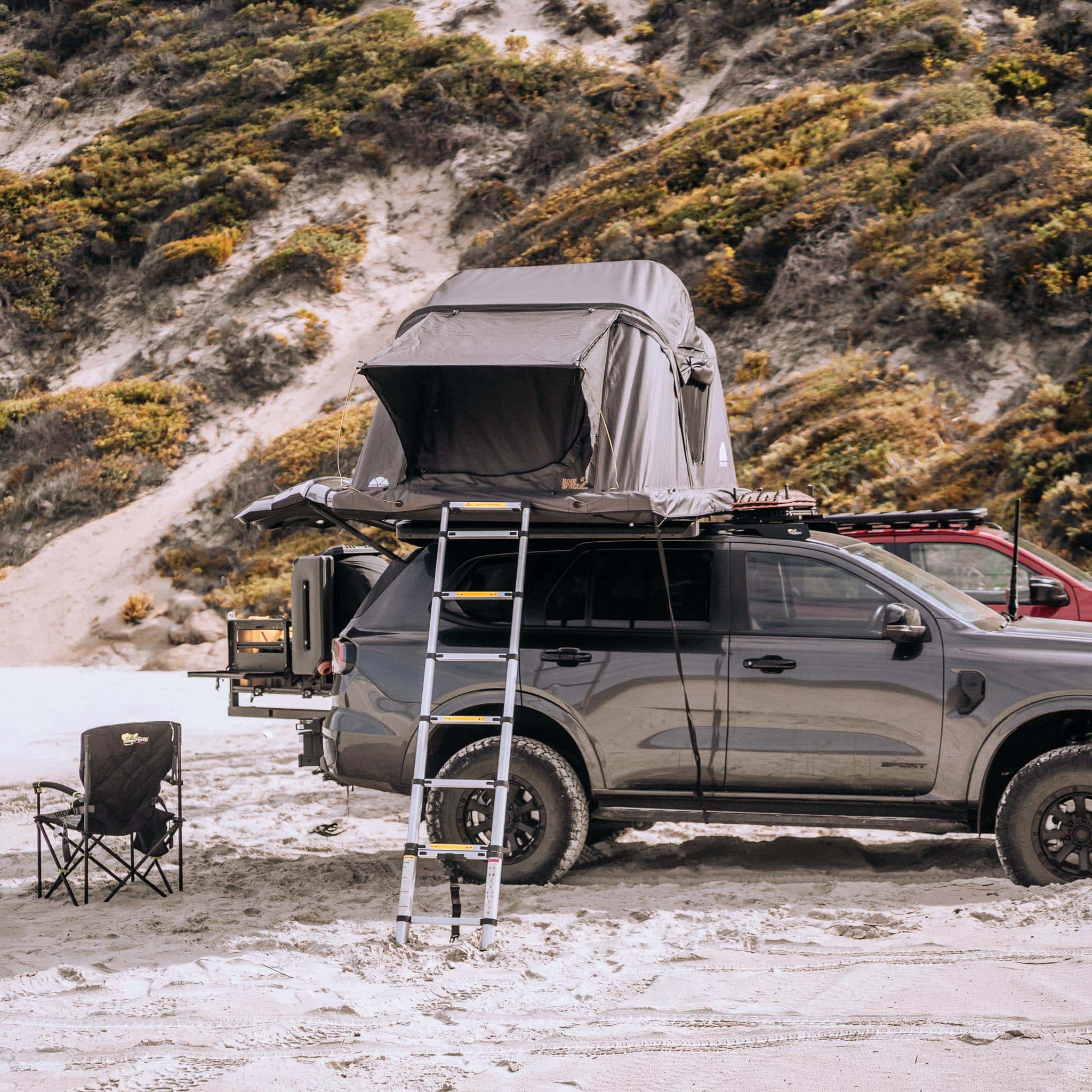 Rear setup showing dual swing-out arms with cargo boxes fitted